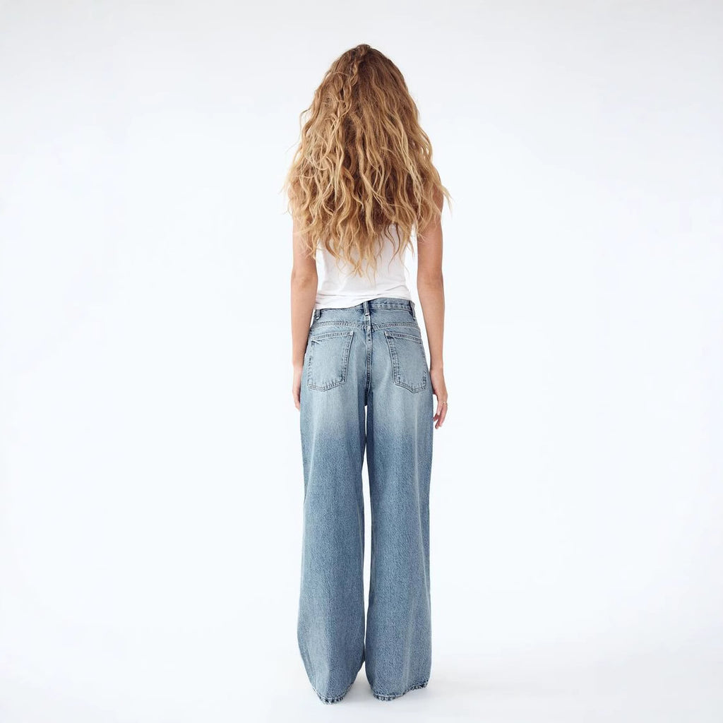 JEANS TIRO-ALTO ASIMÉTRICO