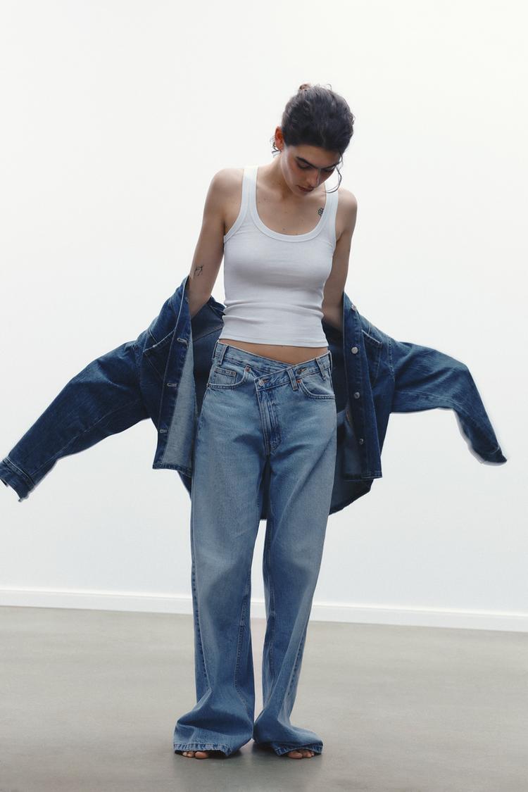 JEANS TIRO-ALTO ASIMÉTRICO