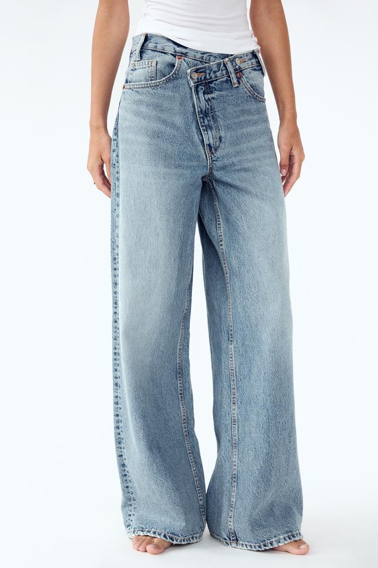 JEANS TIRO-ALTO ASIMÉTRICO